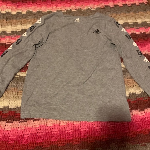 Here is a classic grey adidas shirt it was too small for me so I left it.